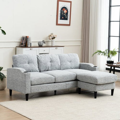Gray sectional sofa in a living room setting with decor elements.