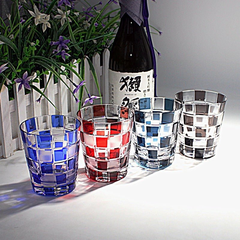 Crystal whiskey glass set with elegant, intricate design and heavy base for stability.
