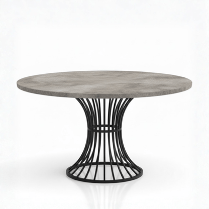 Round dining table with a concrete top and black metal base on a white background
