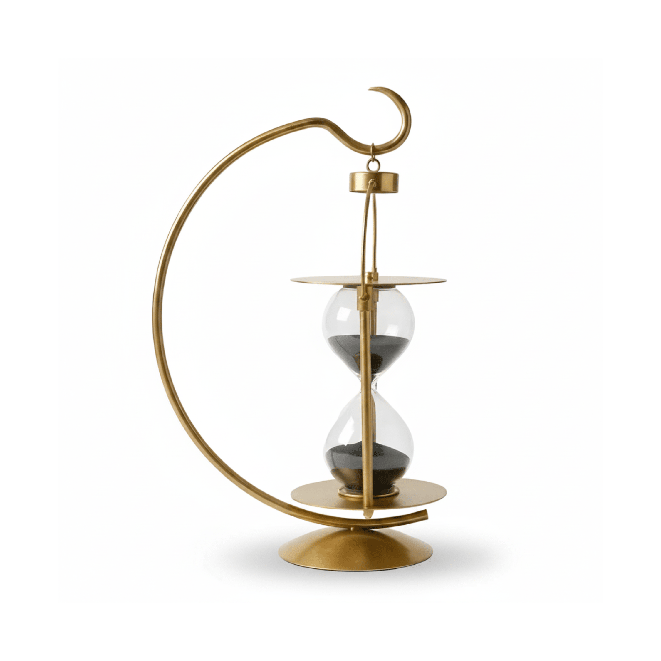 Golden brass arc hourglass with spherical glass chambers and dark sand, luxury home decor timepiece on white background

