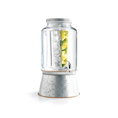 Clear blender with ice and a lemon inside on a white background