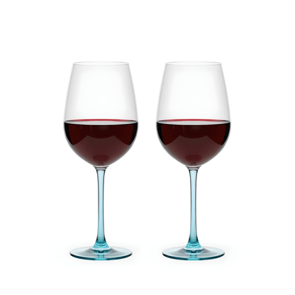 Two wine glasses filled with red wine on a white background