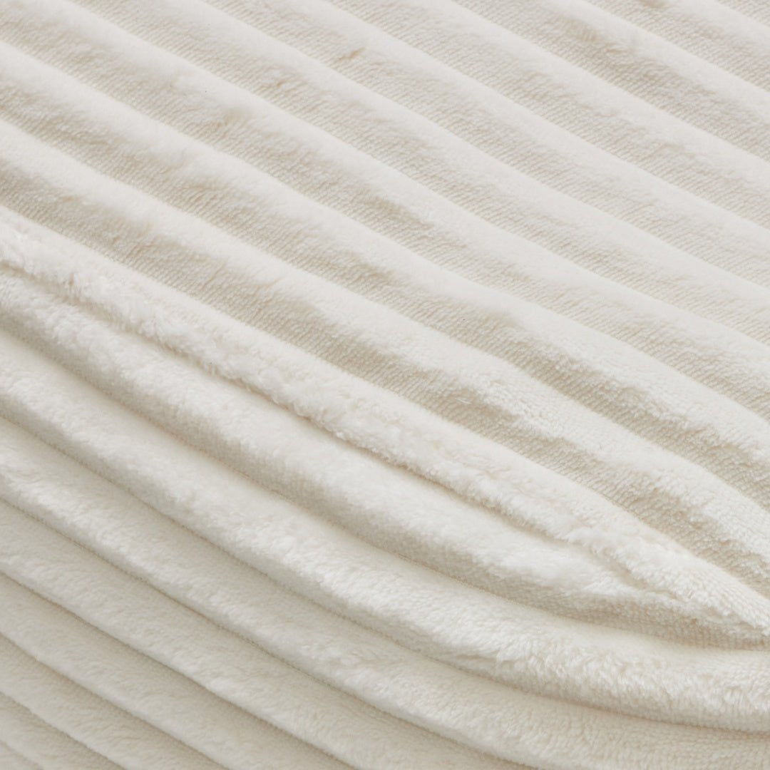 Close-up of textured beige fabric with diagonal lines
