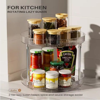 Rotating lazy susan with jars of spices and sauces on a kitchen counter.