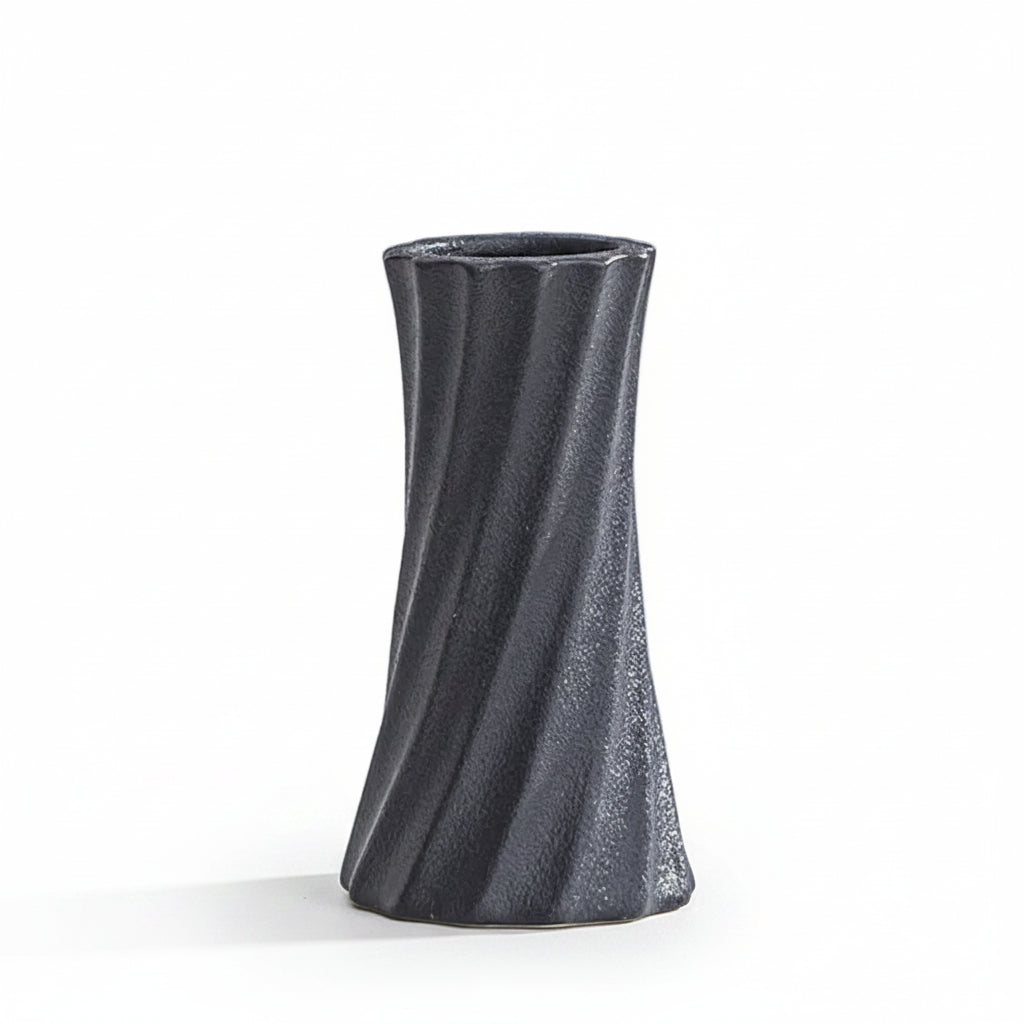 A dark gray textured ceramic vase with a twisted spiral design, shown on a light gray surface with text overlay detailing its dimensions.