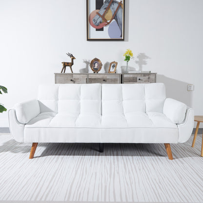 White sofa in a living room with a decorative wall and furniture.