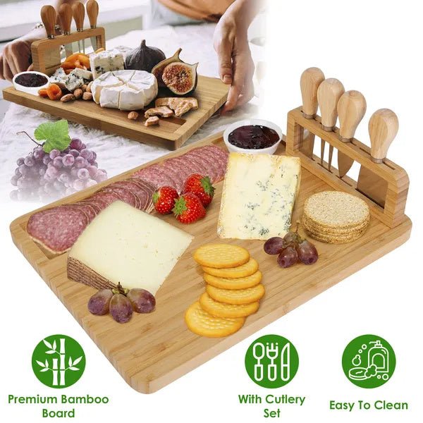 Wooden charcuterie board with meats, cheeses, fruits, and crackers on a white surface.