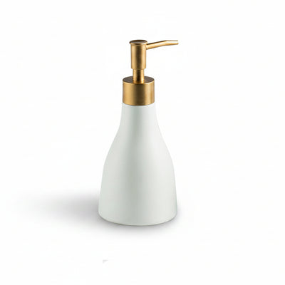 White soap dispenser with gold pump and measurements on a white background