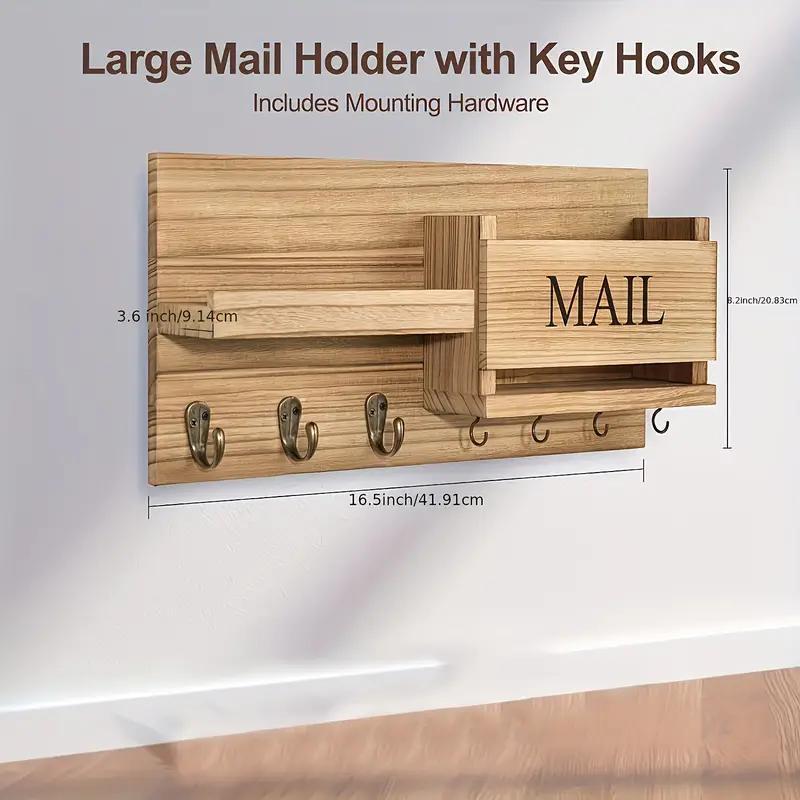 Wooden mail holder with key hooks and 'MAIL' box on a white background
