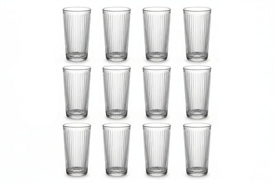 Set of twelve clear glass tumblers with vertical ridges on a white background