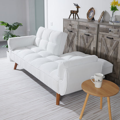 White sectional sofa in a living room with a wooden side table and decorative items.