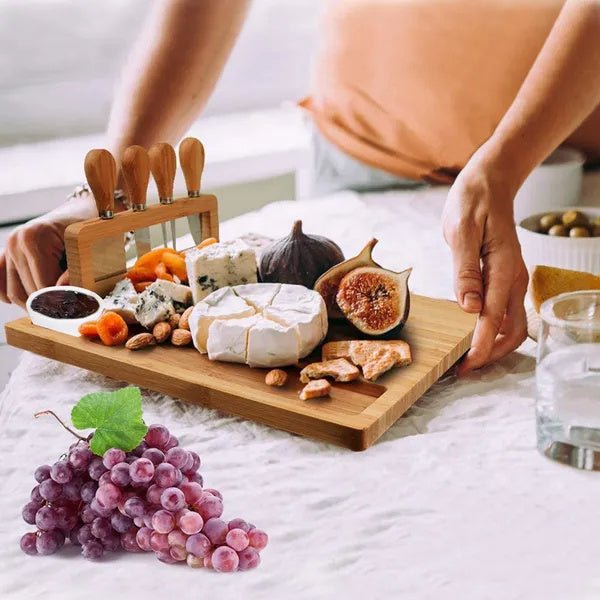 Wooden charcuterie board with assorted cheeses, fruits, and nuts on a bed.