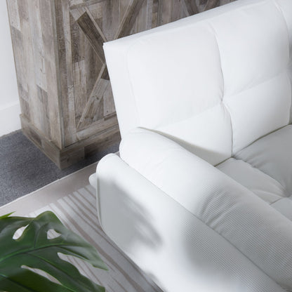 White sofa in a room with wooden wall paneling and a plant.