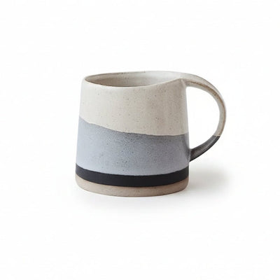 Ceramic mug with two-tone design on a white background