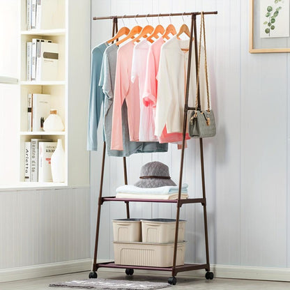 Clothing rack with clothes and bags in a room with shelves and a plant.