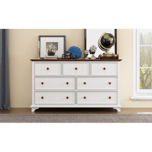 White dresser with wooden top in a room setting