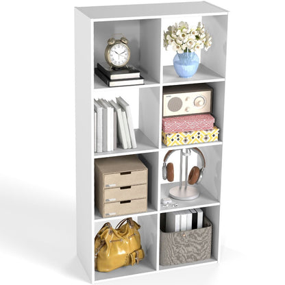 White cube-shaped bookshelf with various items on a white background