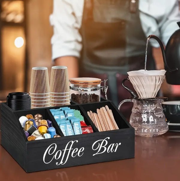 Coffee bar set with various coffee-making items on a wooden surface.