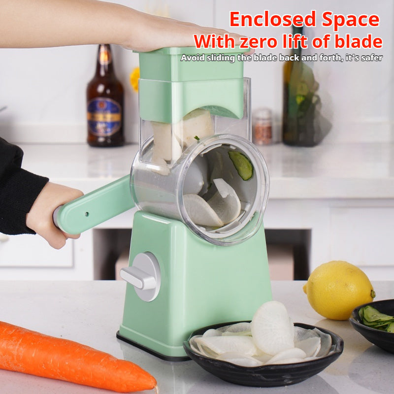 Kitchen hand vegetable slicer in use with enclosed blade for safety.