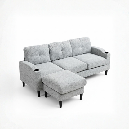 Gray sectional sofa with ottoman on a white background