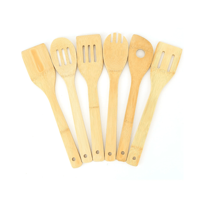 Set of six wooden kitchen utensils on a white background